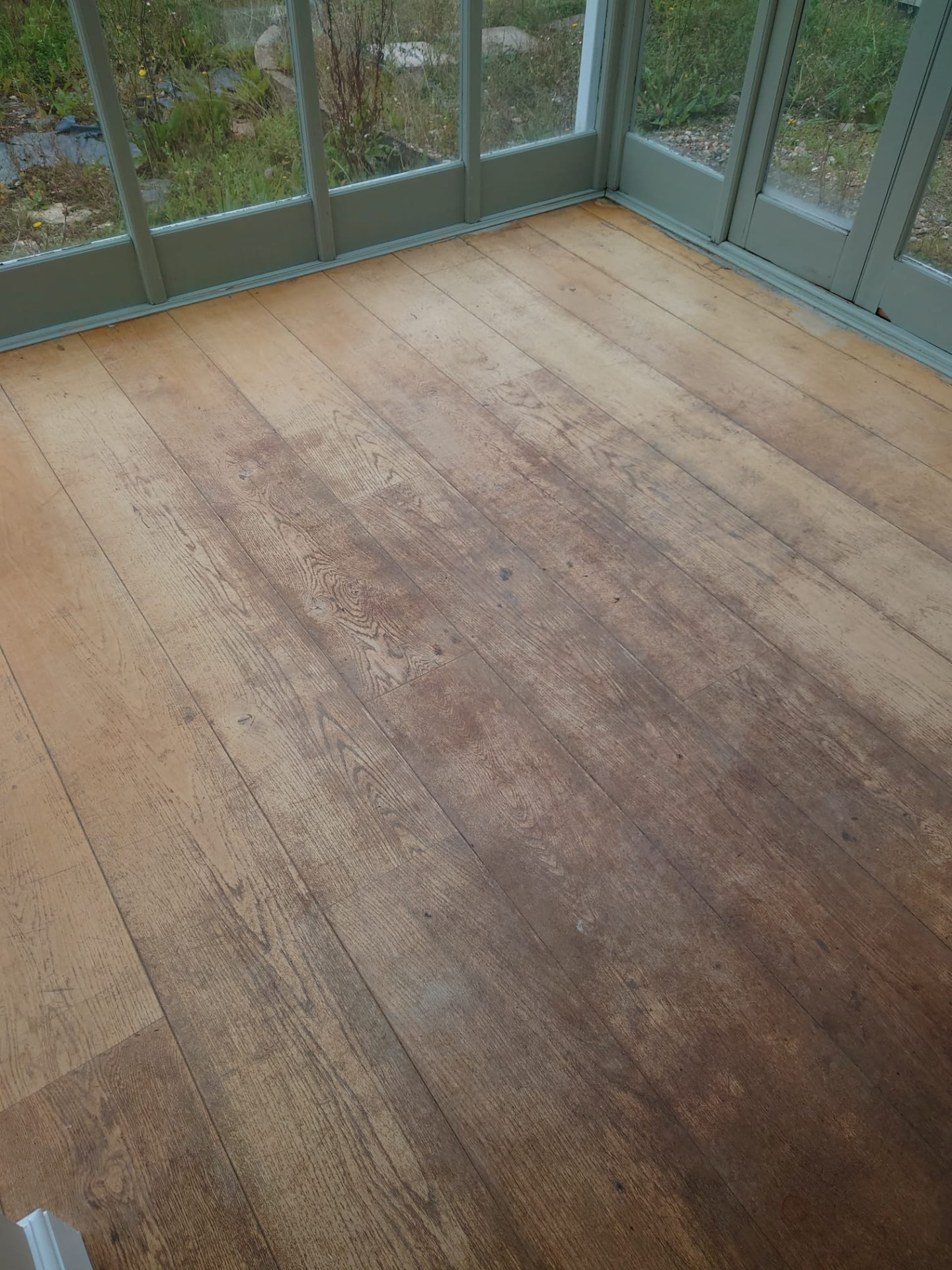 Conservatory wooden floor before sanding and refinishing